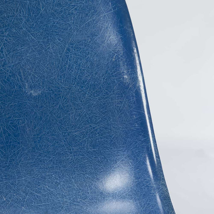 Close up front view of blue Eames DSW dining side chair
