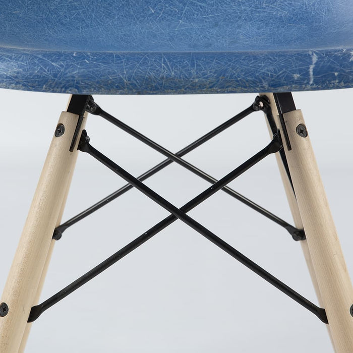 View of base on blue Eames DSW dining side chair