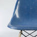 Artistic front view of blue Eames DSW dining side chair