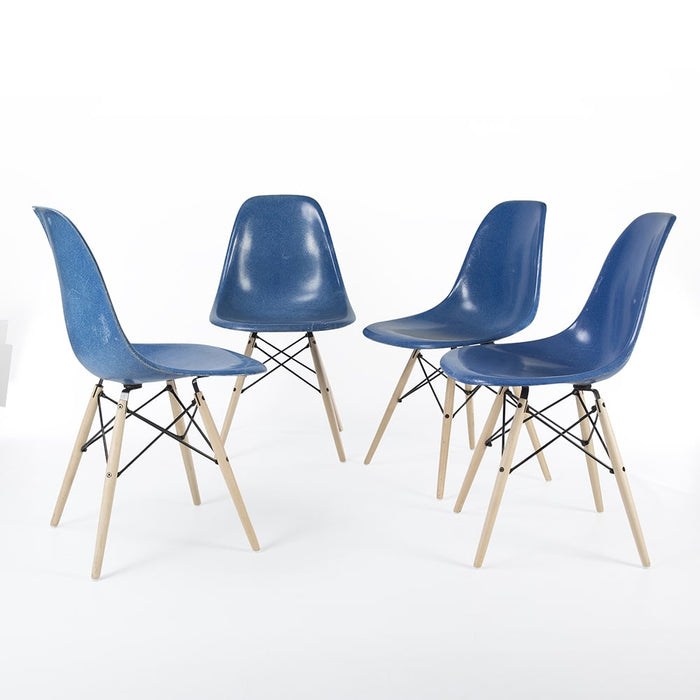Front view of set of 4 blue Eames DSW dining side chairs in a circle