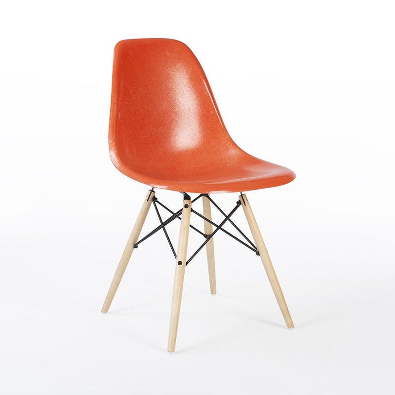 Front angled view of orange Eames DSW dining side chair
