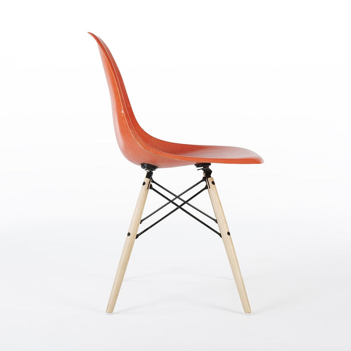 Right side view of orange Eames DSW dining side chair