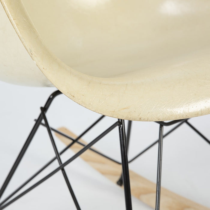 Close up front angled view of parchment Eames RAR rockling chair