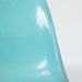 Close up front view of turquoise Eames DSW dining chair