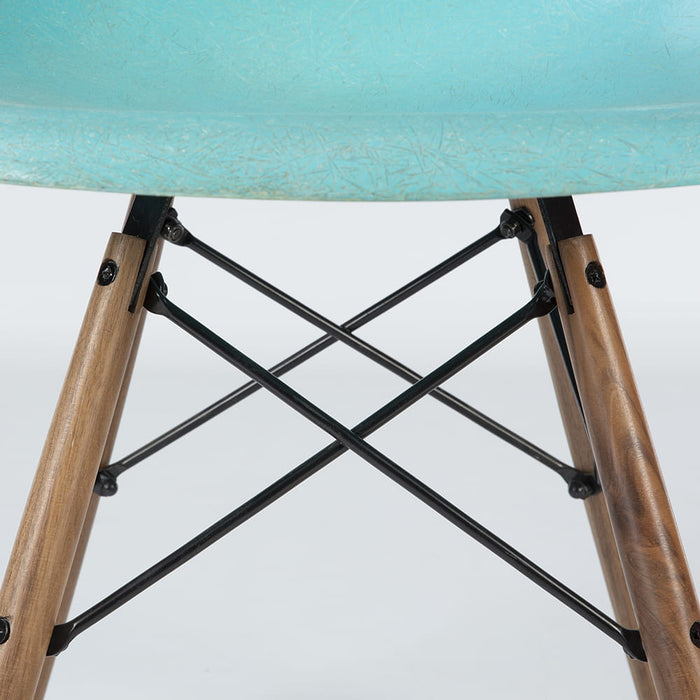 View of base on turquoise Eames DSW dining chair