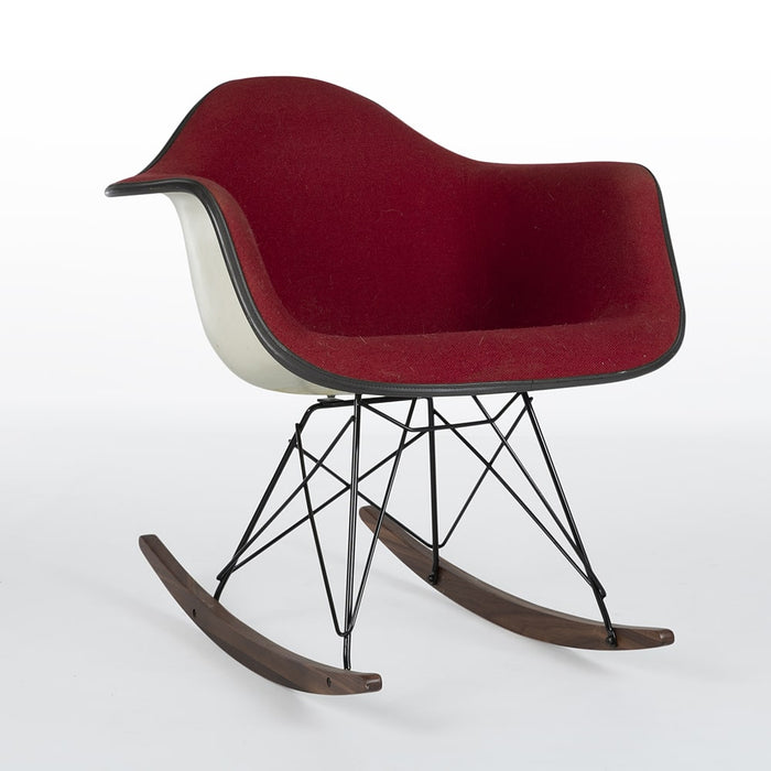 Front angled view of red fabric Eames RAR rocking arm chair
