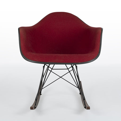 Front view of red fabric Eames RAR rocking arm chair