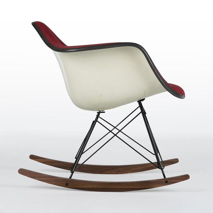 Right side view of red fabric Eames RAR rocking arm chair