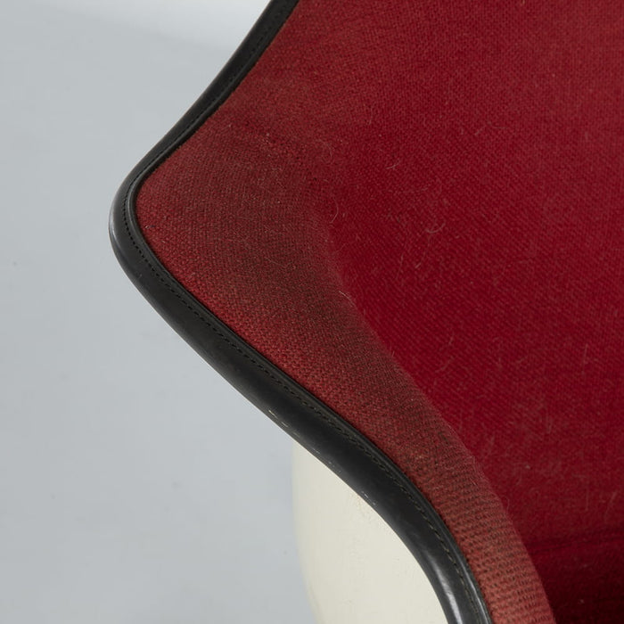 Close up view of arm on red fabric Eames RAR rocking arm chair