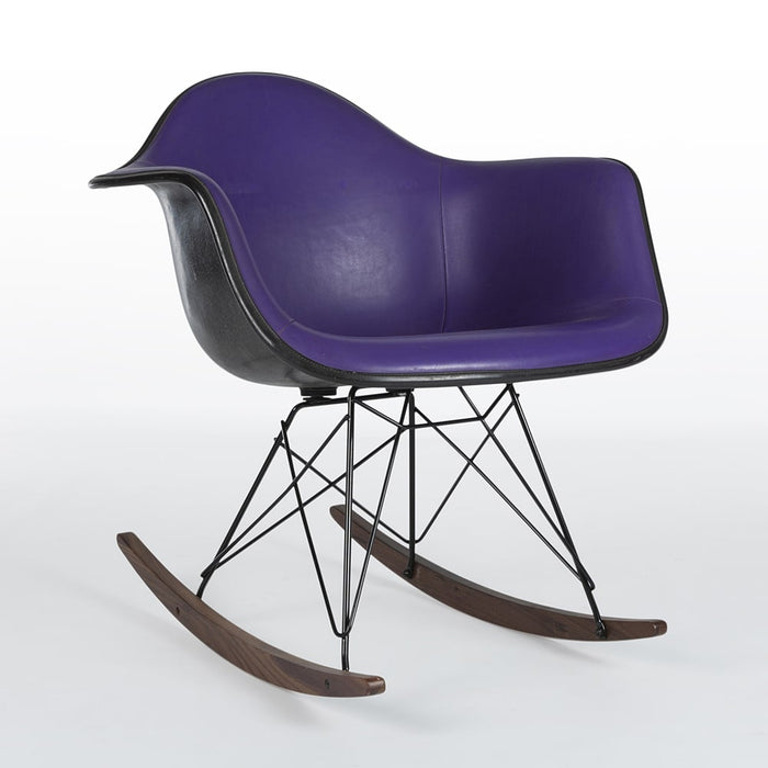 Front angled view of purple and black Eames RAR rocking arm chair