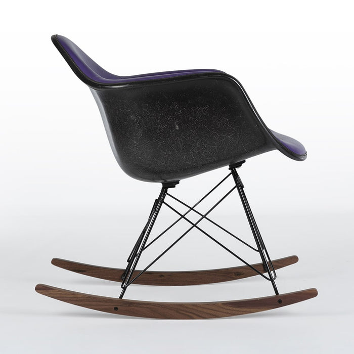 Right side view of purple and black Eames RAR rocking arm chair