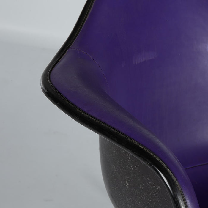 Close up view of arm on purple and black Eames RAR rocking arm chair