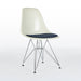 Front angled view of white and blue Eames DFSR dining side chair
