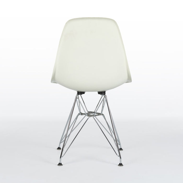 Rear view of white and blue Eames DFSR dining side chair