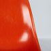 Partial front view of orange Eames DSW