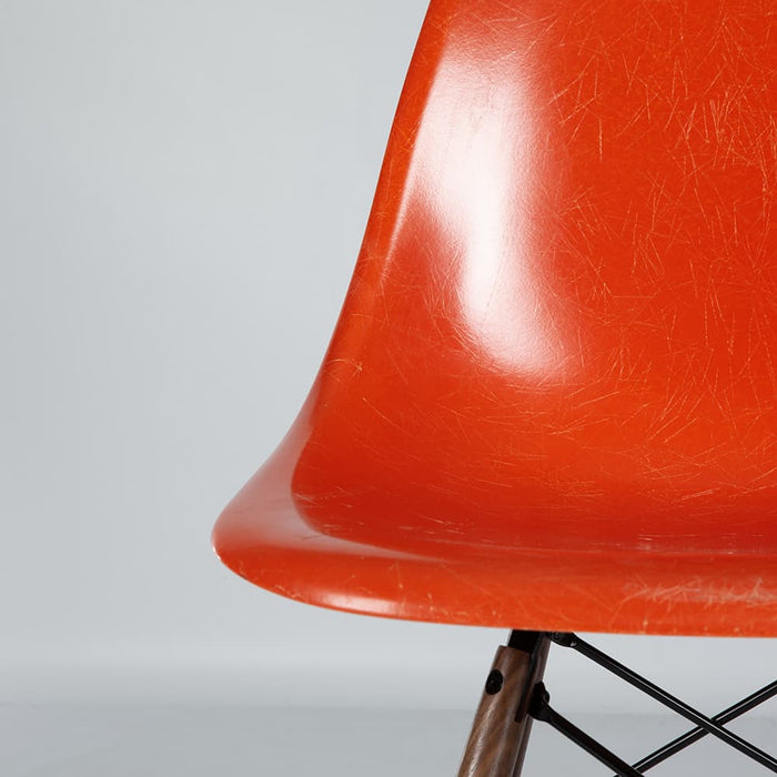 Close up partial view of orange Eames DSW