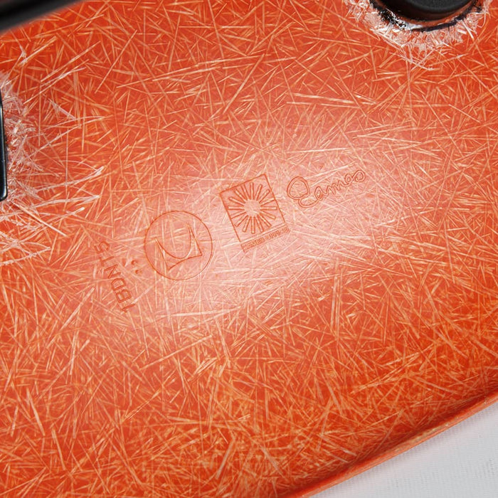 View of logo on orange Eames DSW