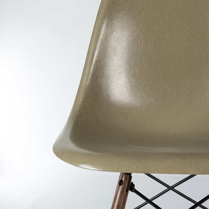 Artistic front view of raw umber Eames DSW dining side chair