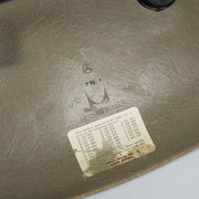 View of logo on raw umber Eames DSW dining side chair