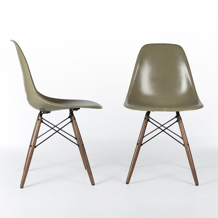 View of pair of raw umber Eames DSW dining side chairs, one from right side, one from front