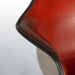 Close up view of arm on red vinyl Eames RAR rocking arm chair