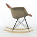 Right side view of red vinyl Eames RAR rocking arm chair