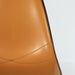 Close up partial front view of Orange on Black Eames DSR