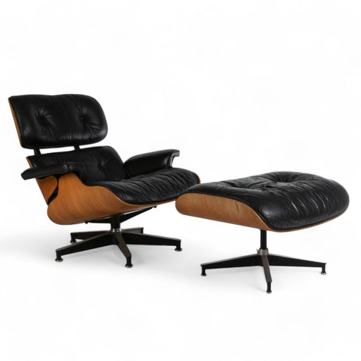 Front angled view of black and rosewood Eames Lounge Chair and Ottoman