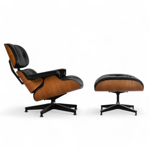 Right side view of black and rosewood Eames Lounge Chair and Ottoman