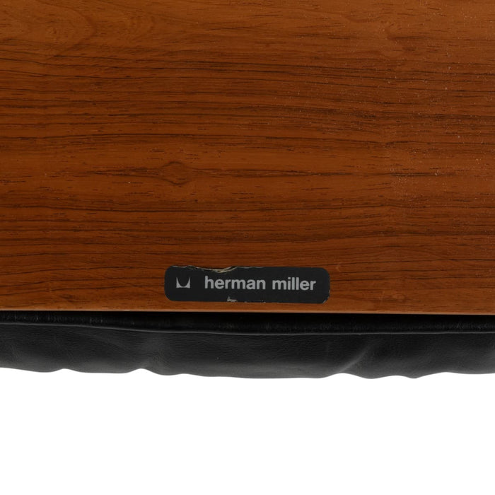 View of label on black and rosewood Eames Lounge Chair and Ottoman