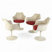 Front view of set of 4 white Saarinen Tulip Arm Chairs in a circle