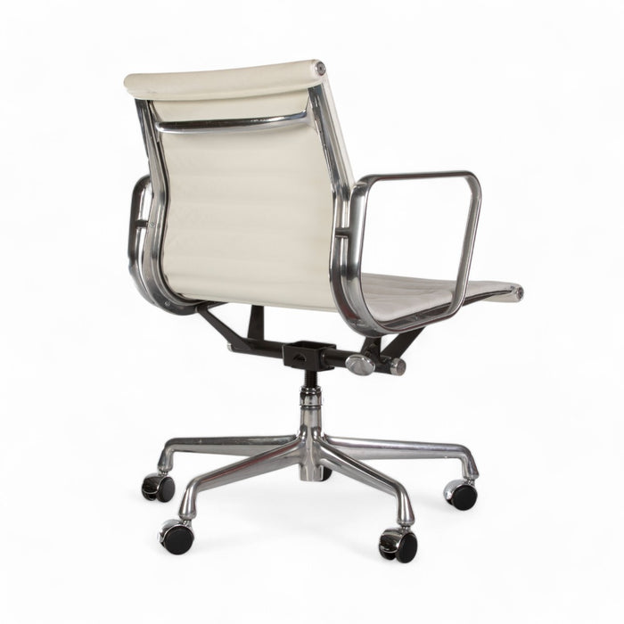 Rear angled view of white Eames EA335 office chair