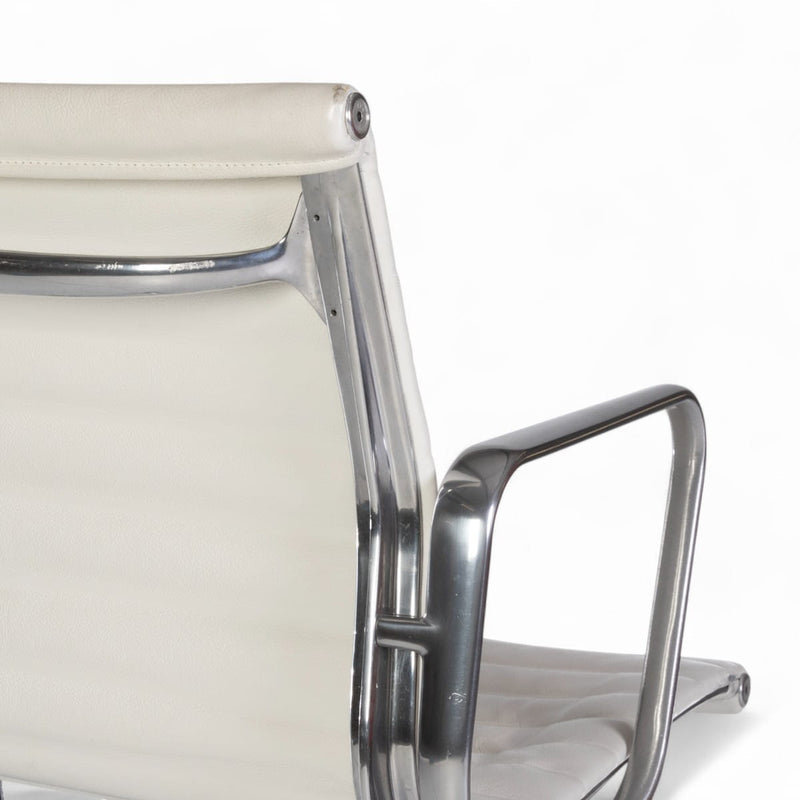 Close up rear angled view of white Eames EA335 office chair