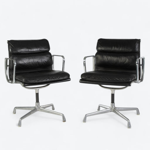 Front view of pair of black Eames EA408S chairs