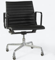 Front angled view of black Eames EA318 office chair