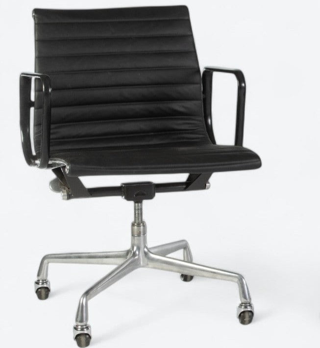 Front angled view of black Eames EA318 office chair