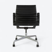 Front view of black Eames EA318 office chair