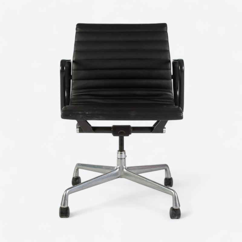 Front view of black Eames EA318 office chair