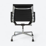 Rear view of black Eames EA318 office chair