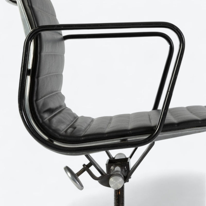 close up right side view of black Eames EA318 office chair