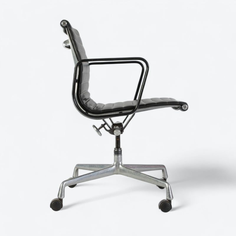Right side view of black Eames EA318 office chair