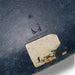 View of label on Navy Blue Eames DSW