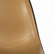 Partial close up front view of beige Eames DSR