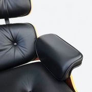 Close up view of arm on black and santos Eames Lounge Chair