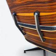Close up rear angled view of black and santos Eames Lounge Chair