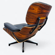 Rear left side angled view of black and santos Eames Lounge Chair