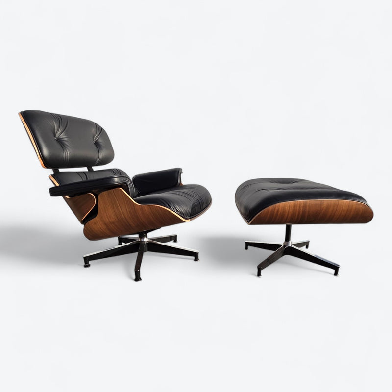 Angled right side view of black and walnut Eames Lounge Chair and Ottoman
