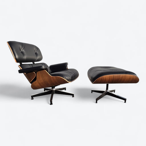 Angled right side view of black and walnut Eames Lounge Chair and Ottoman