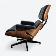 Left side view of black and walnut Eames Lounge Chair