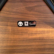 View of label black and walnut Eames Lounge Chair and ottoman